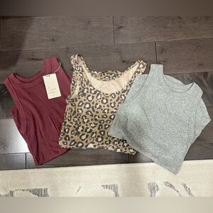 a new day Burgundy, Leopard, and Gray Tank Tops. Never worn